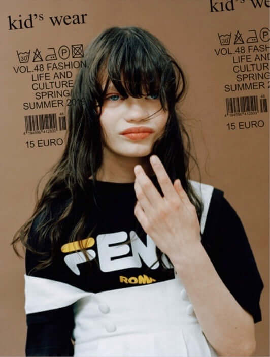 Kids Wear Magazine cover girl in black and white top