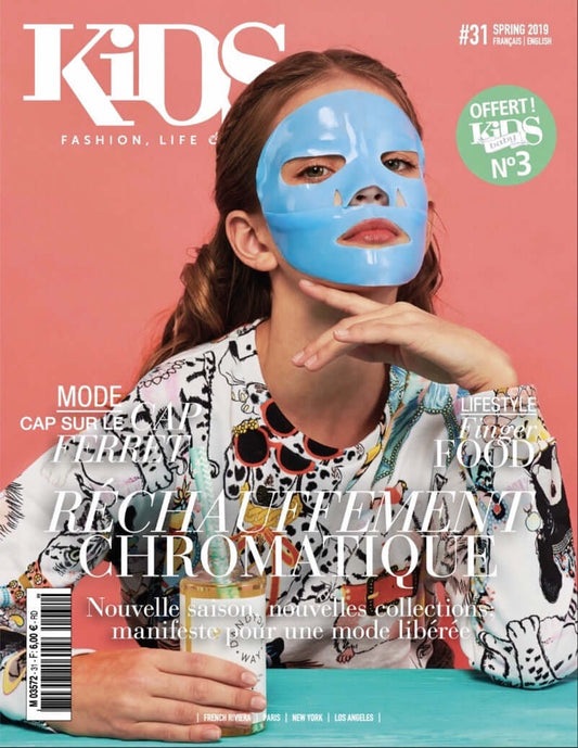 kids magazine cover, girl with blue face mask holding dandydill way bubble bath
