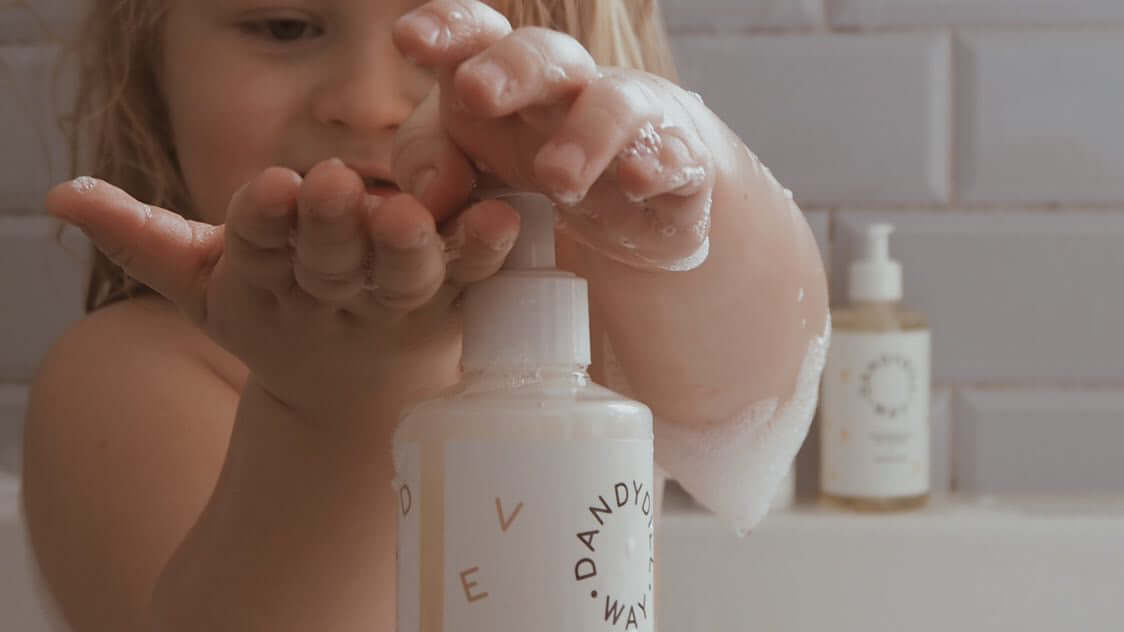 Child in bubble bath with Dandydill Way SLS Free Shampoo
