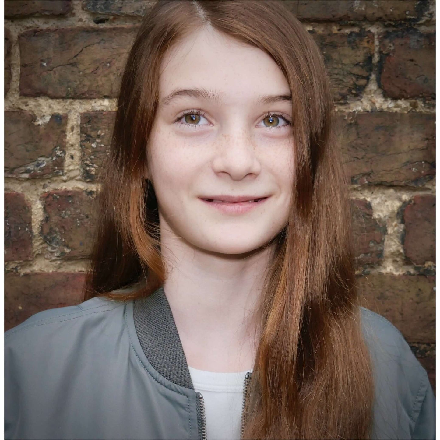 girl with shiny healthy hair smiling