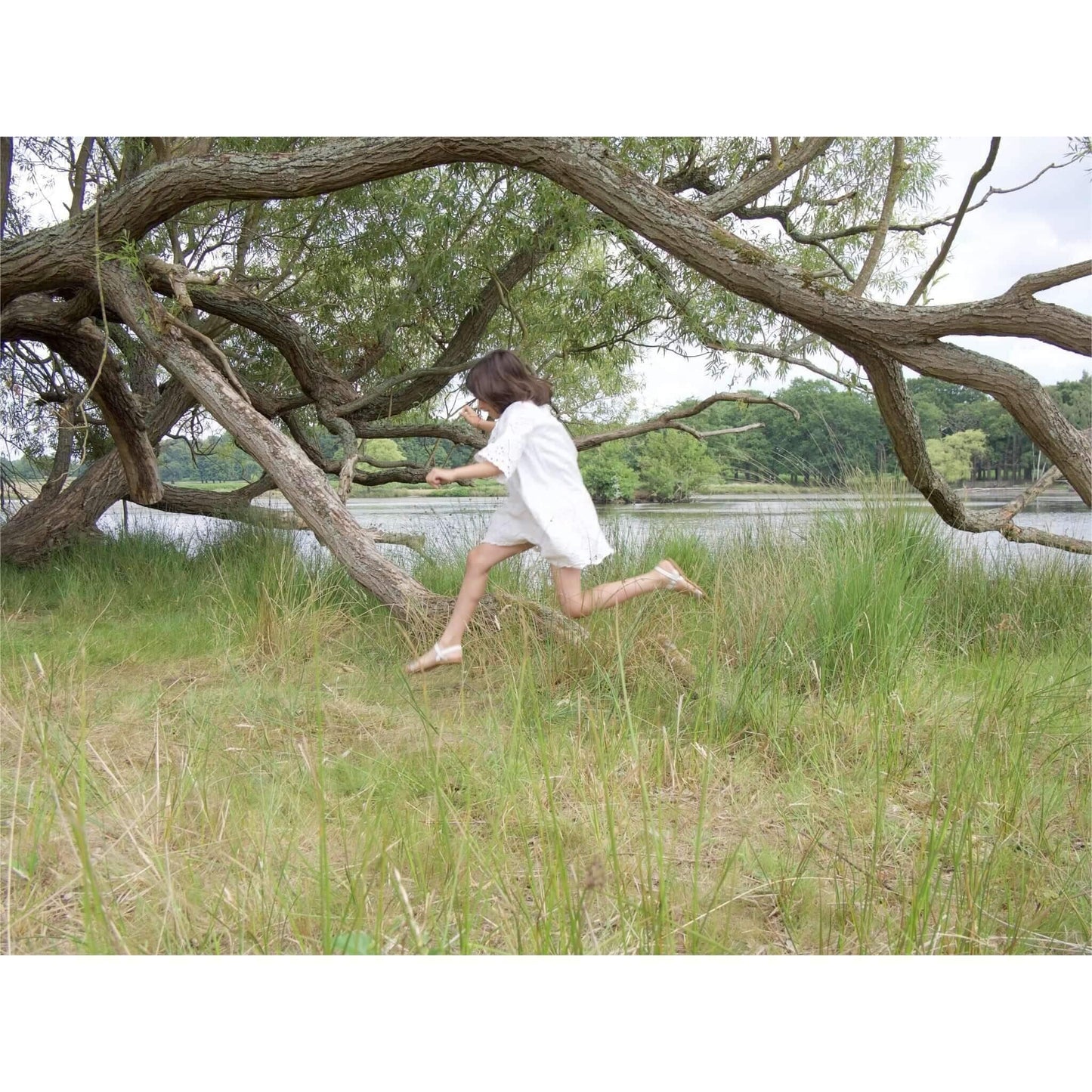 young girl playing outdoors in the countryside