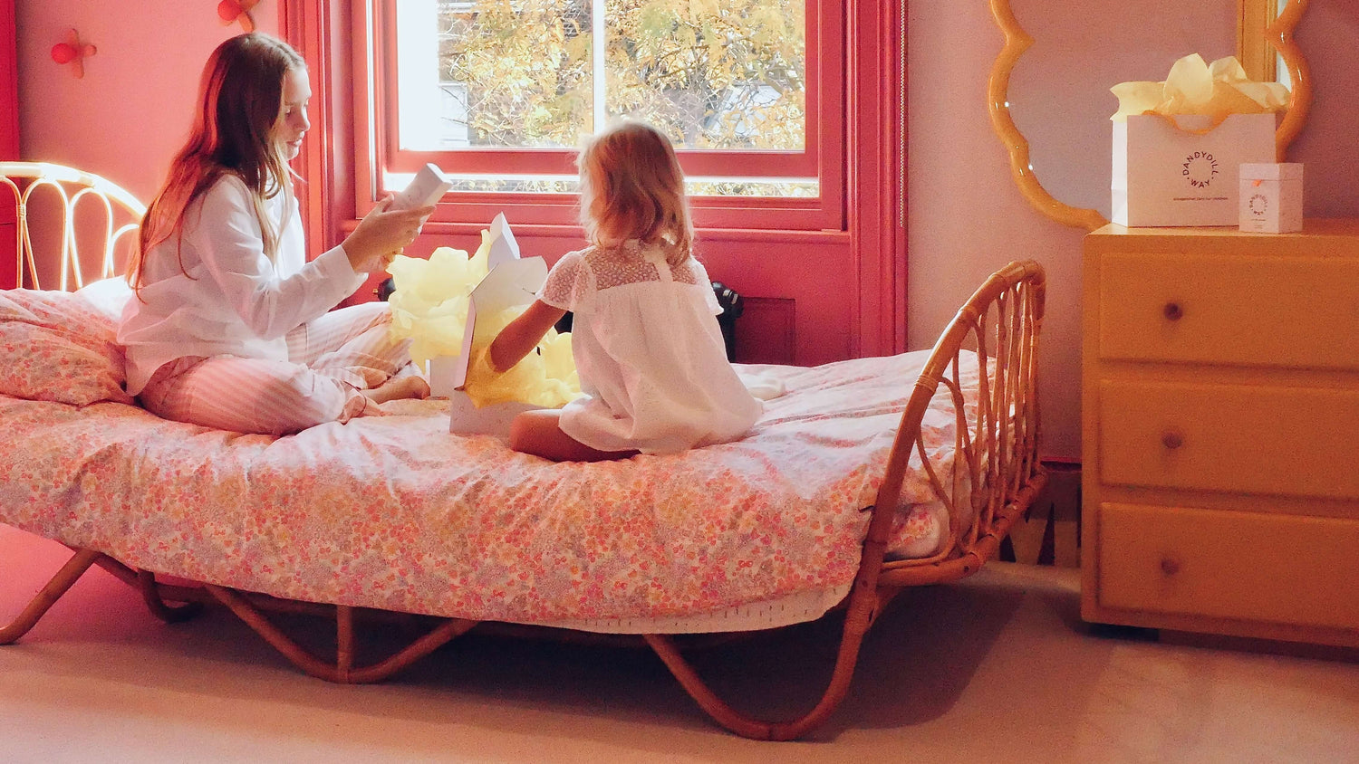 two young girls opening natural perfume gifts for kids