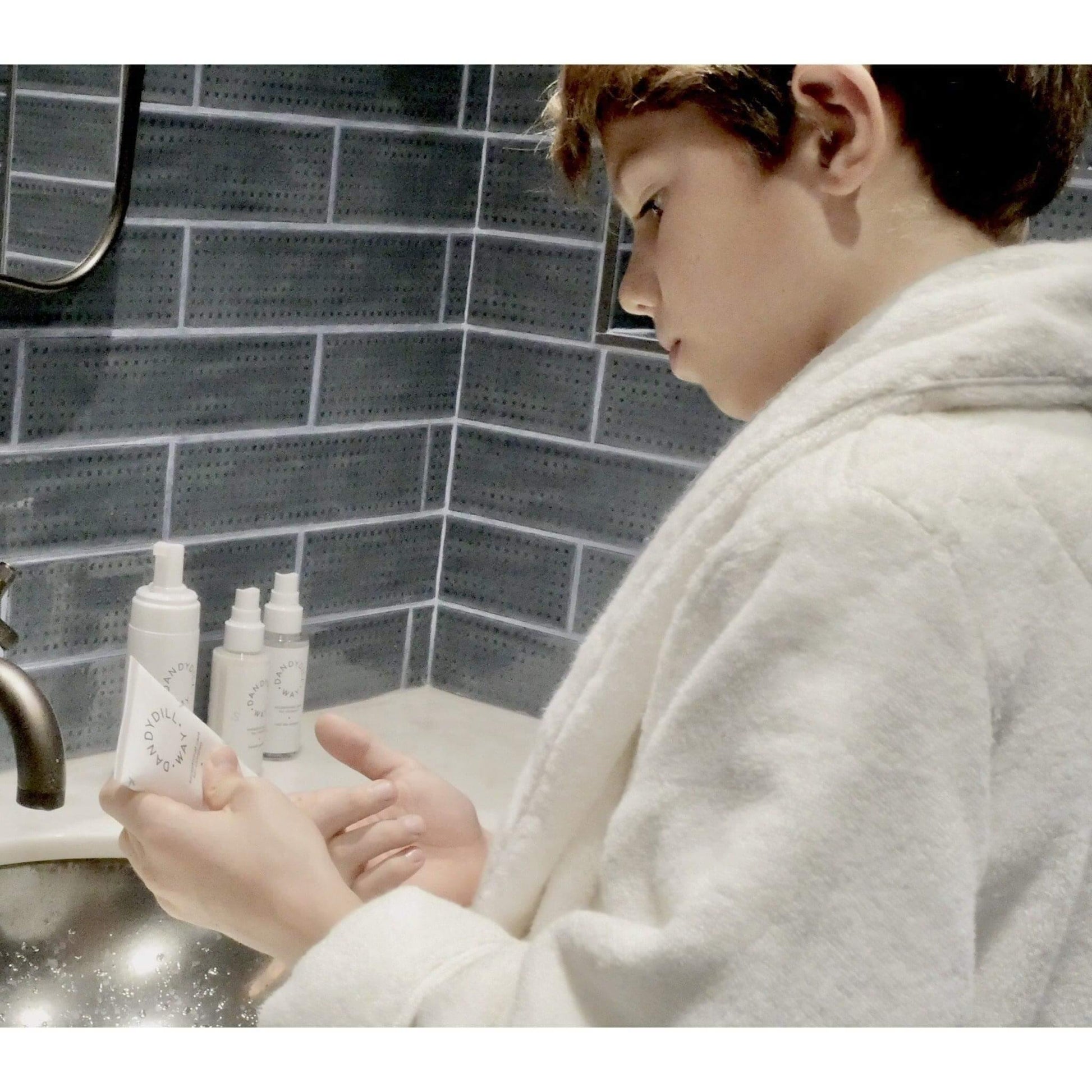 Boy using fragrance free Sensitive Skin Care moisturiser with hyaluronic acid